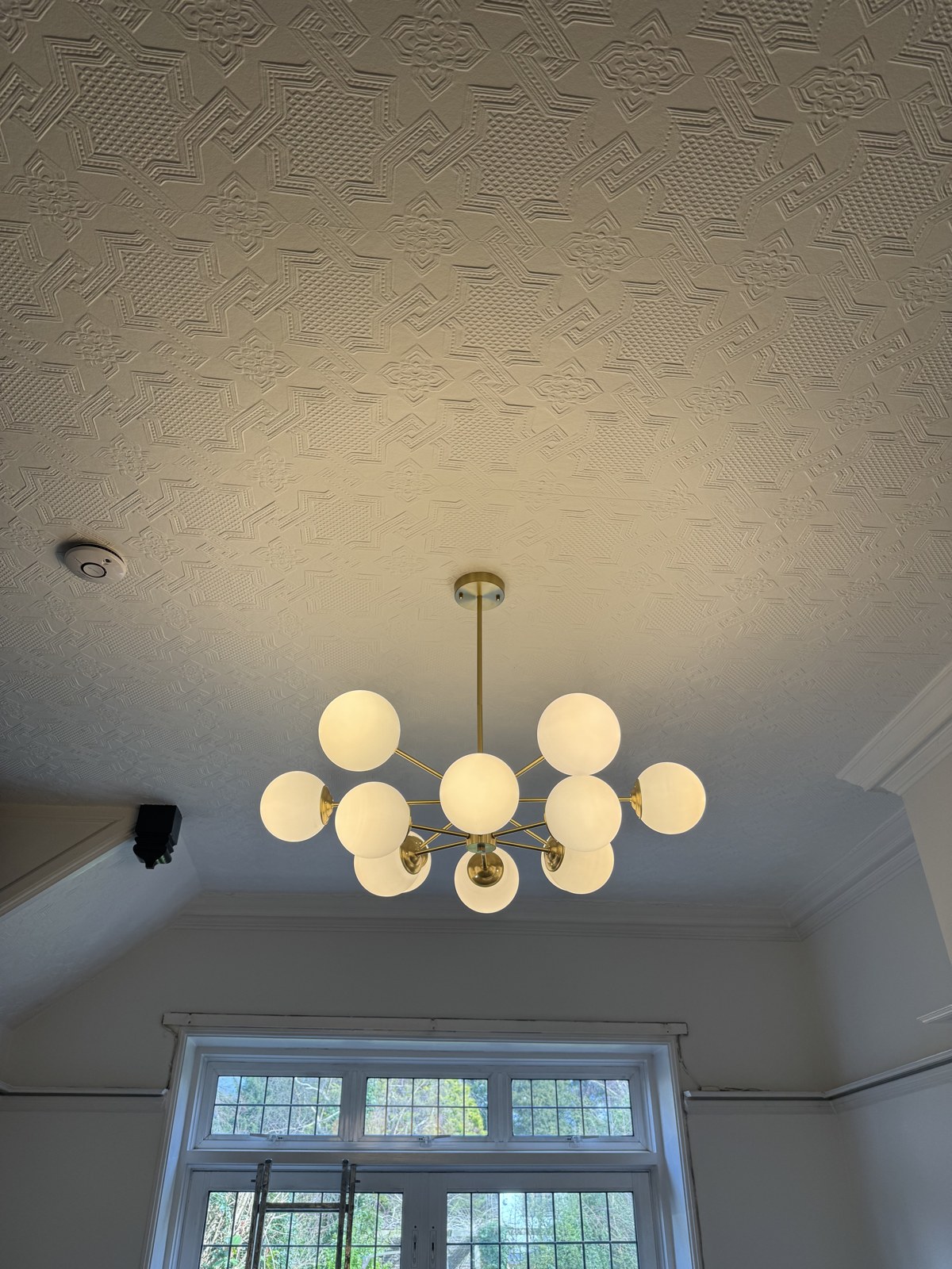 Feature brass globe chandelier installation, Surrey