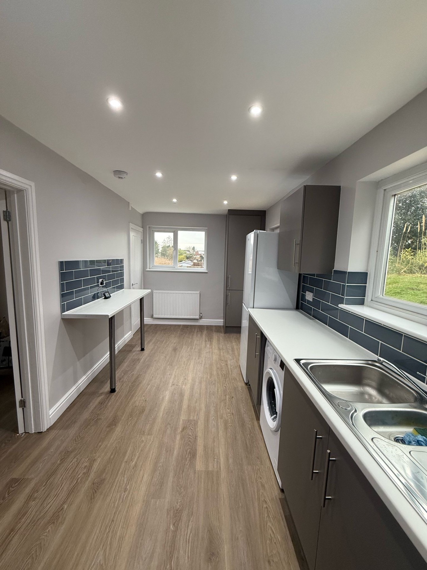 Kitchen with new ceiling light, downlights and sockets after a full rewire