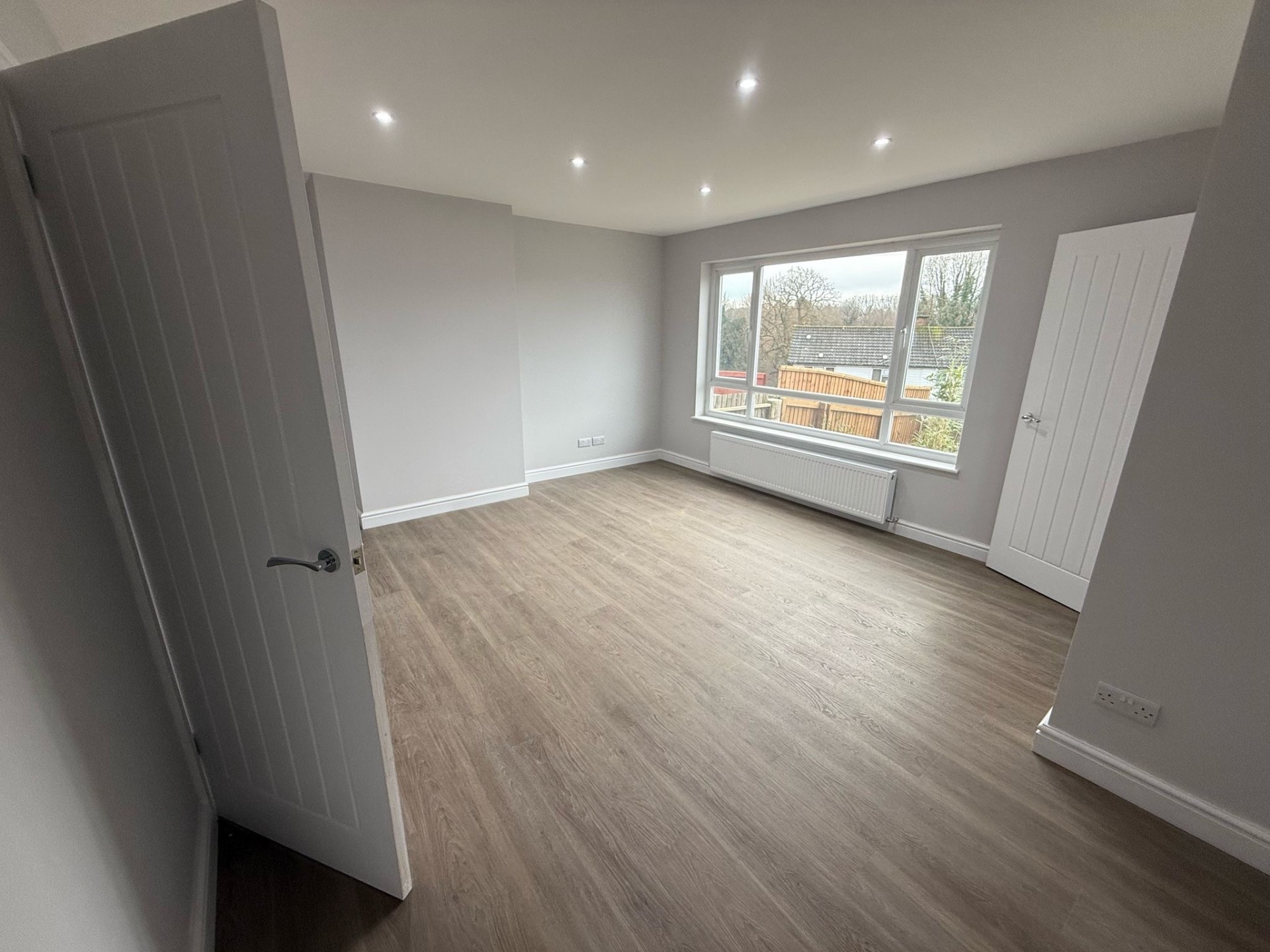 Refurbished bedroom with new downlights and sockets after a full rewire