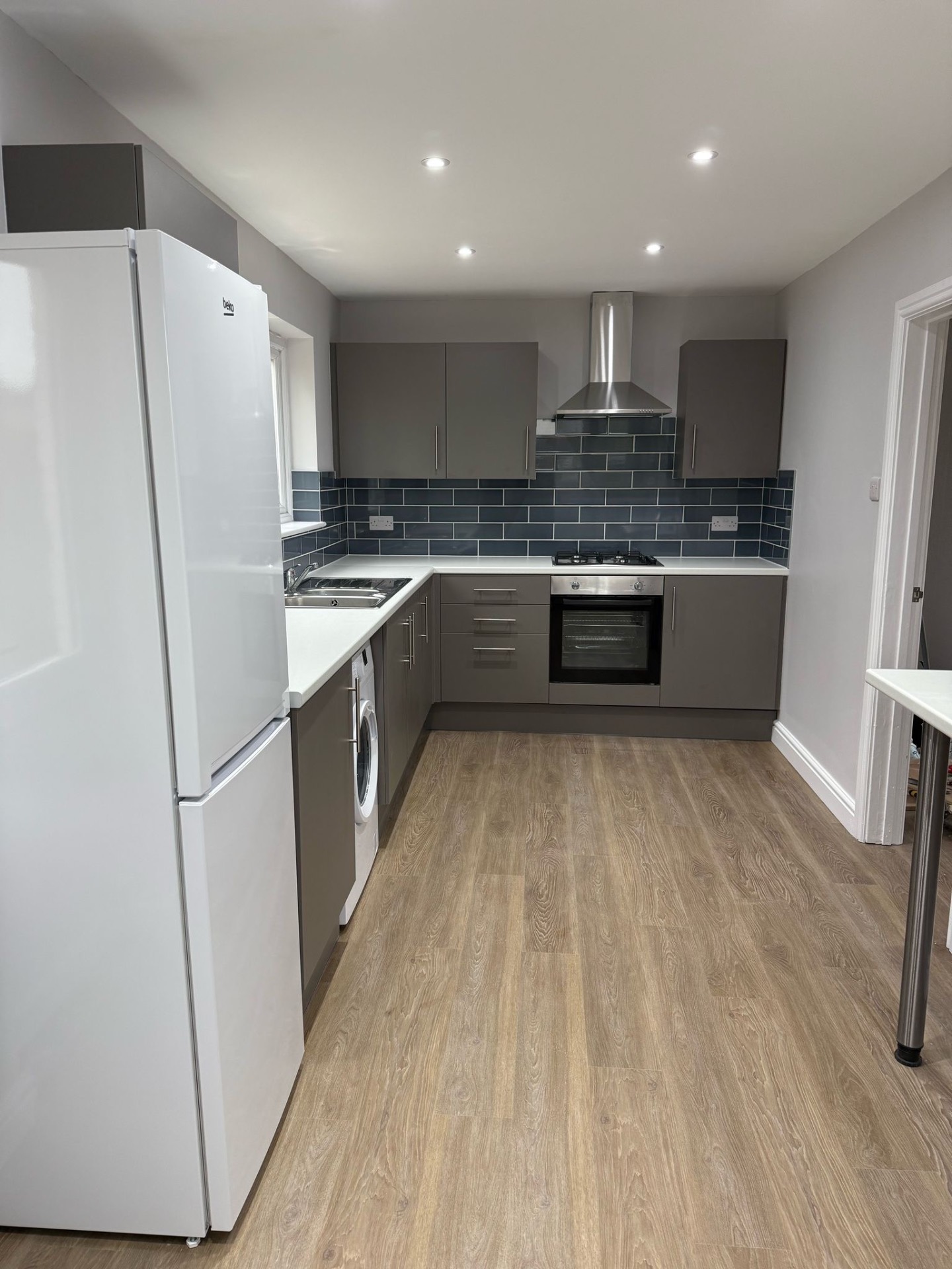 Refitted kitchen with new downlights and sockets after a full rewire