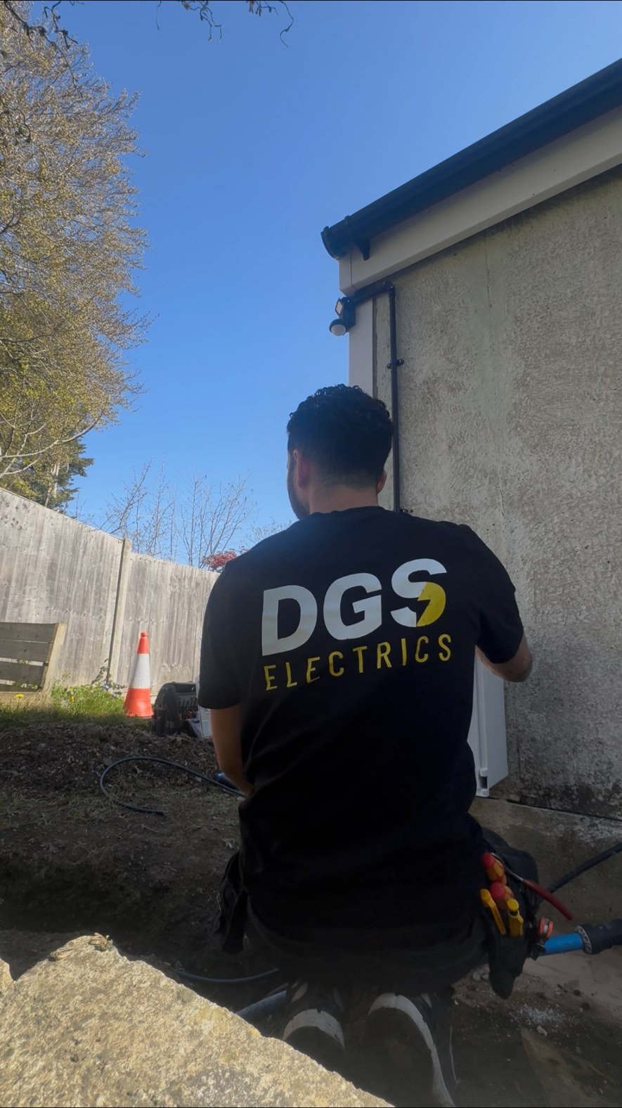 DGS Electrics branded workwear on-site in Surrey